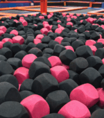Grey and pink foam cubes in a trampolinepark